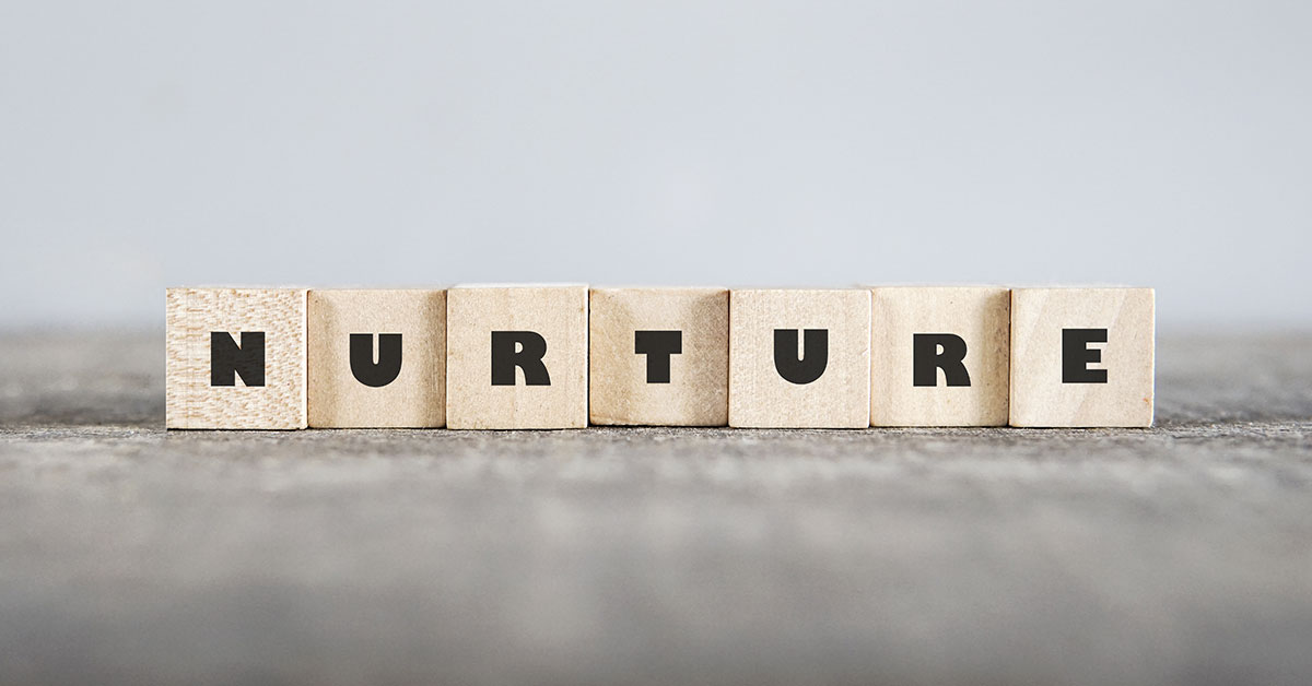 Wooden blocks that spell out "nurture"
